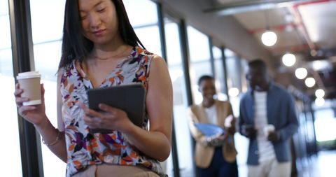Businesswoman Holding Tablet in Modern Office - Download Free Stock Images Pikwizard.com