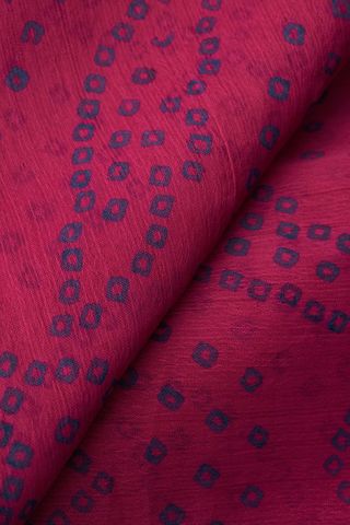 Magenta handloom textile featuring navy geometric dot pattern and fine weave texture
