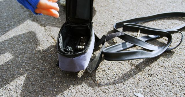 Close-up of Bicycle Tire Repair Kit on Pavement - Download Free Stock Images Pikwizard.com