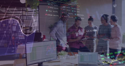 Diverse Team Collaborating on Financial Data in Office