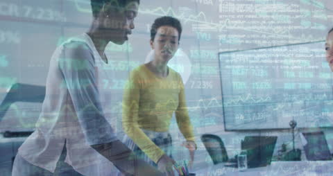 Multicultural Businesswomen Analyzing Financial Data in Modern Office