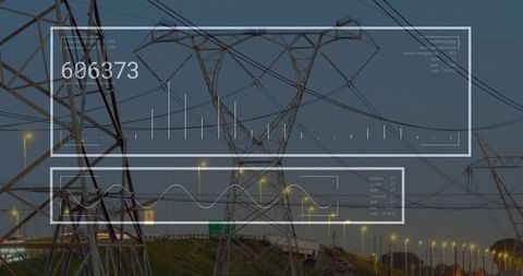 High-Voltage Transmission Tower Carrying Power Lines Above Highway at Dusk with HUD Data Overlay