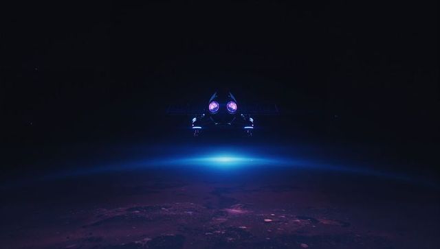 Futuristic spacecraft hovering above planet in low orbit