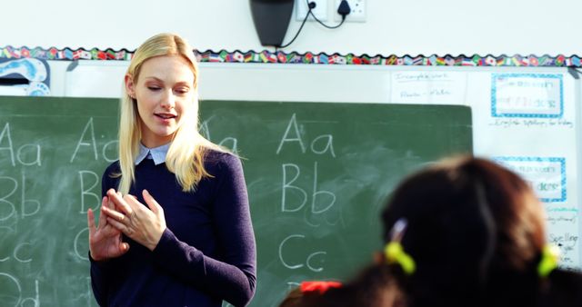 Female Teacher Giving Lesson in Classroom - Download Free Stock Images Pikwizard.com