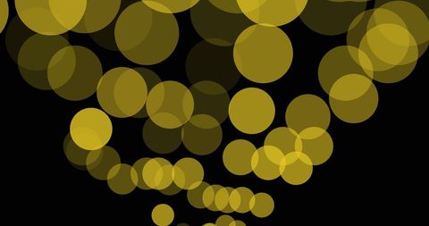 Abstract Yellow Light Spots on Black Background