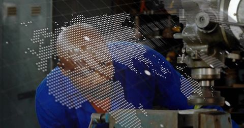 Machinist inspecting metal workpiece with digital overlay in workshop