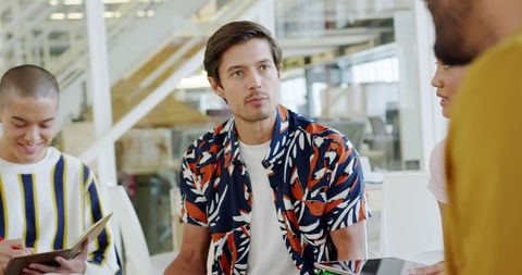 Young professional in discussion at modern office