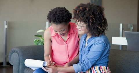 Happy Couple Embracing on Comfortable Living Room Sofa