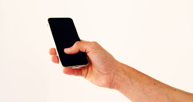 Hand holding smartphone against white background - Download Free Stock Images Pikwizard.com