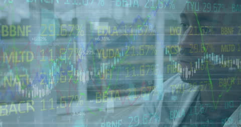 Businessman Analyzing Stock Market Trends on Computer Screen