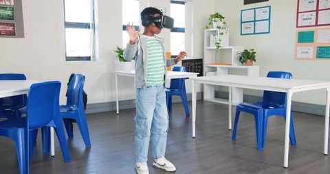 Teen using vr headset in classroom exploring immersive virtual reality learning and technology
