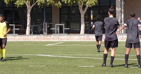 Youth soccer players preparing for action amidst competition