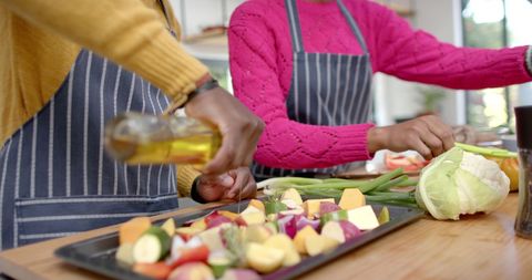 Couple Cooking Together with Fresh Ingredients in Kitchen