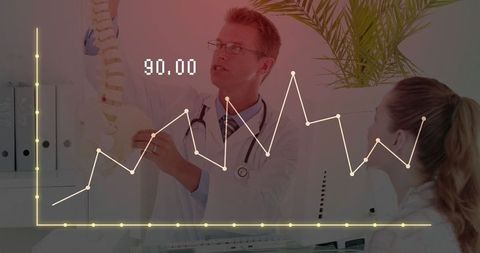 Doctor explains spine model with graphical data overlay