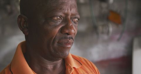 Contemplative African Man in Township Close-Up - Download Free Stock Images Pikwizard.com