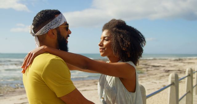 Romantic diverse couple standing and embracing on sunny promenade, copy space. Summer, vacation, romance, love, relationship, free time and lifestyle, unaltered.