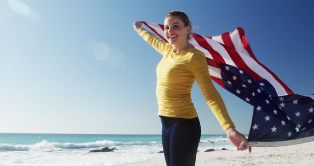 Woman Celebrating with American Flag on Beach - Download Free Stock Images Pikwizard.com
