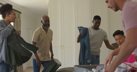 Friends Packing for Wedding Trip Together at Home