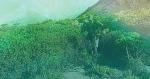 Hiker on Rugged Coastal Trail with Backpack and Trekking Gear