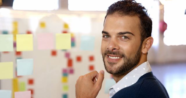 Confident Businessman Smiling at Office Whiteboard with Sticky Notes - Download Free Stock Images Pikwizard.com