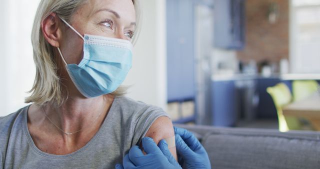 Smiling Woman Receiving Vaccination Indoors Wearing Face Mask - Download Free Stock Images Pikwizard.com