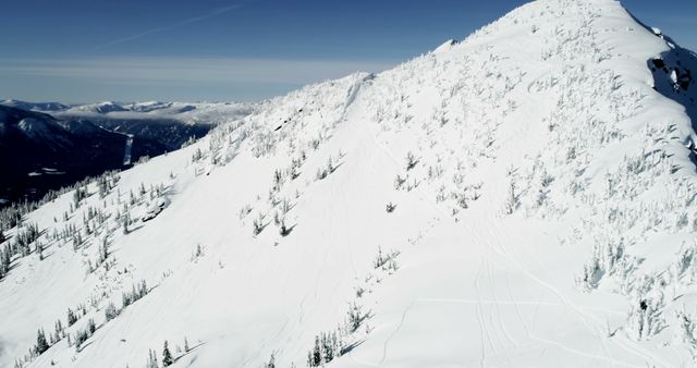 Aerial View of Snow-Covered Mountain Peak in Winter - Download Free Stock Images Pikwizard.com