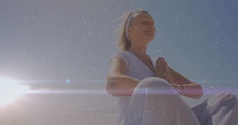 Serene outdoor meditation on tranquil sandy beach