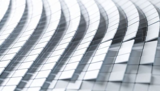 Reflective metallic tile waves forming curved grid pattern for modern architecture background