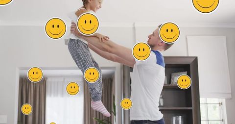 Happy Father and Daughter Playing Together at Home with Smiley Graphics