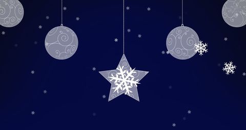 Silver Ornaments and Star Hanging Against Blue Backdrop