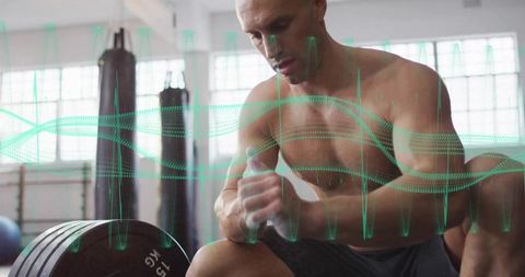 Athlete Applying Chalk Preparing to Lift Barbell in Industrial Gym