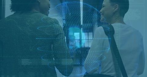 Coworkers walking down office corridor with holographic digital globe and HUD overlay