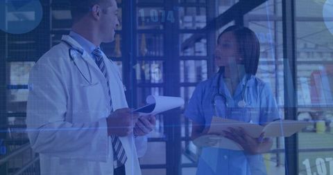 Doctor and Nurse Discussing Diagnoses with Digital Overlays in Hospital Corridor