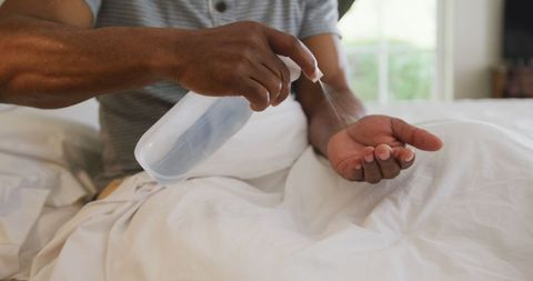 Senior Man Sanitizing Hands for Health Safety at Home - Download Free Stock Images Pikwizard.com