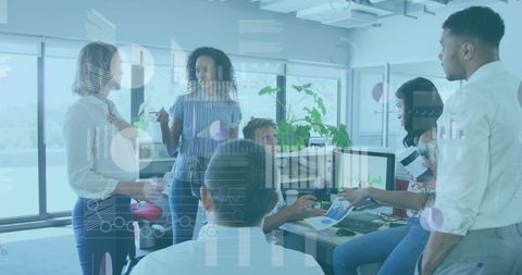 Diverse Team Discussing Financial Data Innovation in Modern Office - Download Free Stock Images Pikwizard.com