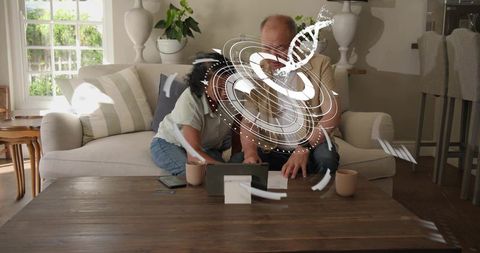 Senior mother and adult son exploring genetic results on tablet with holographic dna