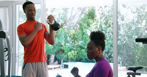 Couple Exercising at Home with Determination and Focus