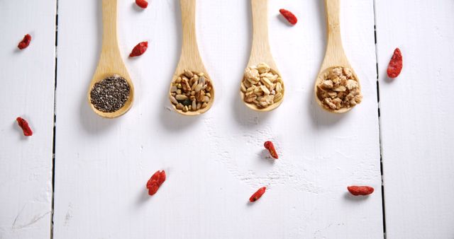 Assortment of Superfoods in Wooden Spoons on White Background - Download Free Stock Images Pikwizard.com