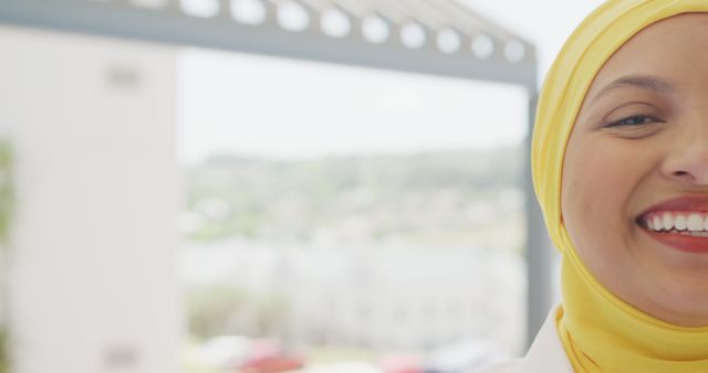 Close-up of Smiling Woman in Yellow Hijab Outdoors - Download Free Stock Images Pikwizard.com