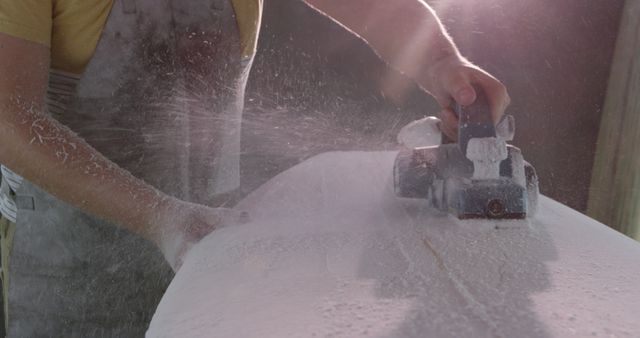 Craftsman Shaping Wood with Power Tool Amidst Flying Sawdust - Download Free Stock Images Pikwizard.com