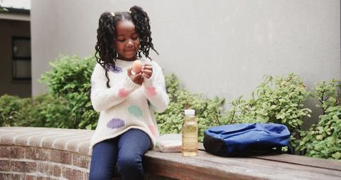 Young girl exploring outdoor environment with travel gear