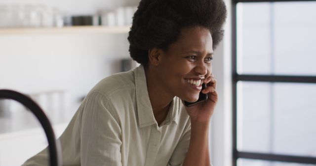 Smiling Woman Having Phone Conversation at Home Office - Download Free Stock Images Pikwizard.com