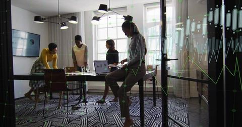 Team analyzing data in modern conference room