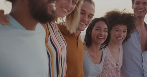 Diverse Friends Laughing and Embracing Outdoors in Joyful Moments