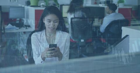 Financial Data Overlay with Businesswoman Using Smartphone