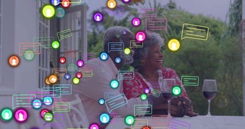 Senior couple enjoying outdoor leisure amidst digital interactions