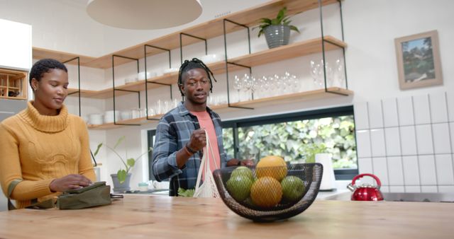 African American Couple Unpacking Groceries Together in Modern Kitchen - Download Free Stock Images Pikwizard.com