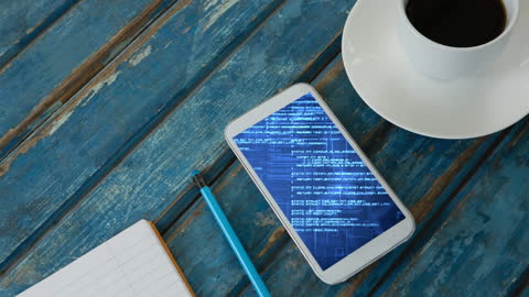 Smartphone Displaying Data on Wooden Table with Coffee