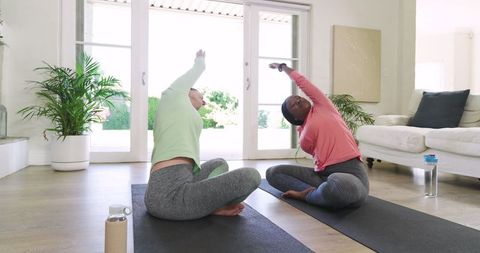 Diverse Friends Practicing Yoga at Home for Mindfulness