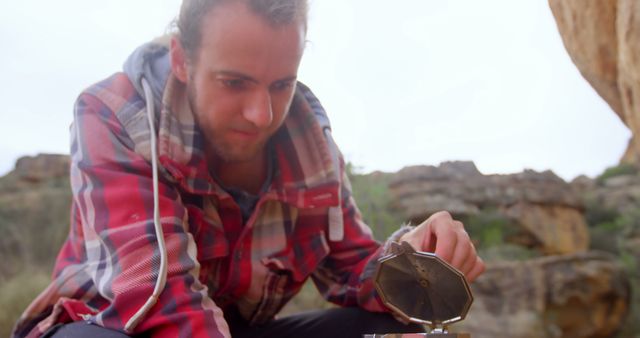 Man Exploring Nature With Compass in Rocky Terrain - Download Free Stock Images Pikwizard.com